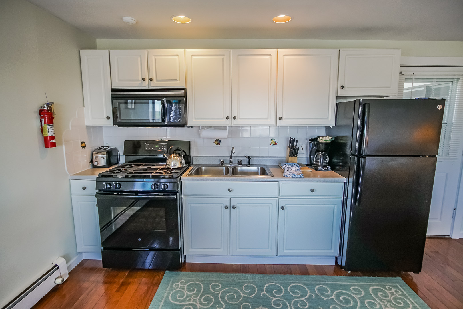 A traditional Kitchenette at VRI's Neptune House Resort in Rhode Island.